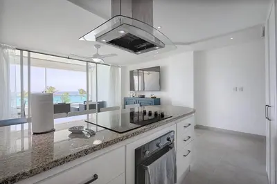 a kitchen with a sink and a large window at Apartamento En Marbella Vista Al Mar in Villas del Mar