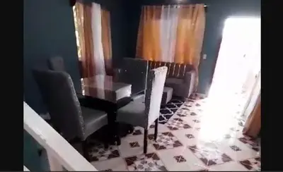 a living room with a table and chairs at Don Carlos Recidencia