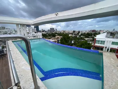 a swimming pool on the roof of a building at Maravilloso Descanso in Santo Domingo
