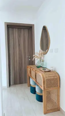 a bathroom with a wooden table and a mirror at Relax in Style at Hard Rock Hotel Punta Cana Apartment in Punta Cana