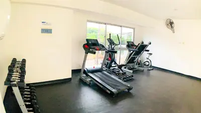 a gym with two exercise bikes in a room at Apartamento en Boca Chica T2 707 in Boca Chica