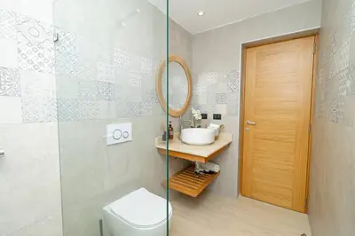 a bathroom with a toilet and a sink and a shower at Tropical 1BR Getaway in Dominicus Bayahibe - Garden Breeze