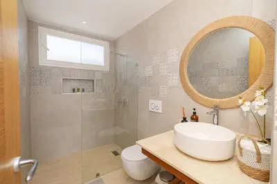 a bathroom with a sink and a shower and a mirror at Tropical 1BR Getaway in Dominicus Bayahibe - Garden Breeze