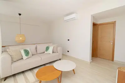 a living room with a couch and a table at Tropical 1BR Getaway in Dominicus Bayahibe - Garden Breeze