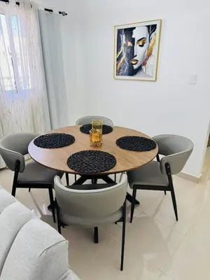 a dining room table with chairs and a drink on it at Welcome Home 2 in Boca Canasta