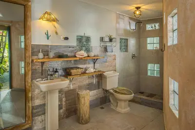 a bathroom with a toilet and a sink at Lux Garden Loft close to Beach, Kite-school in Cabarete