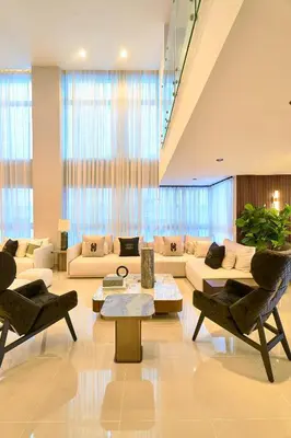 a large living room with couches and chairs at Acqualina’s View @ Santo Domingo in Santo Domingo