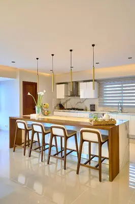 a kitchen with a large wooden table and chairs at Acqualina’s View @ Santo Domingo in Santo Domingo