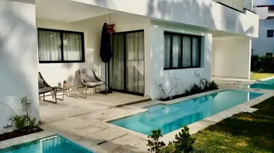 a house with a swimming pool in the backyard at Swim-Up Paradise, AirBB for more info in Punta Cana
