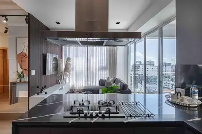 a kitchen with a stove top oven in a room at ®{LUX~City~Skyline} @DowntownSD PrivéJaccuziGym in Santo Domingo