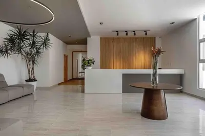 a living room with a table and a kitchen at ®{LUX~City~Skyline} @DowntownSD PrivéJaccuziGym in Santo Domingo