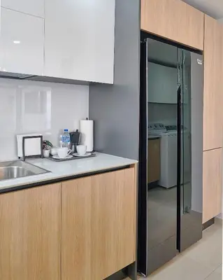 a kitchen with a sink and a counter top at ®2BR{The~City~Center}@DTown PoolGym NearCecilip in Santo Domingo