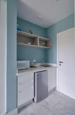 a kitchen with a sink and a microwave at {3BR~Beach~Condo}@LakeView PlayaBonita PoolLUX in Las Terrenas
