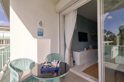 a dining room with a table and two chairs at {3BR~Beach~Condo}@LakeView PlayaBonita PoolLUX in Las Terrenas