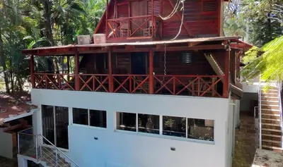 a house being constructed with a red roof at Wooden Paradise in Jarabacoa in Jarabacoa