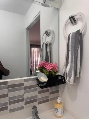 a bathroom with a sink and a mirror at quality & comfort in Santo Domingo