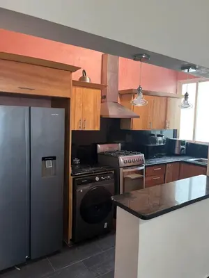 a kitchen with a stove and a refrigerator at Dreamvillage in Boca Chica