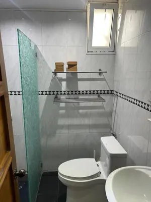 a small bathroom with a toilet and a sink at Dreamvillage in Boca Chica