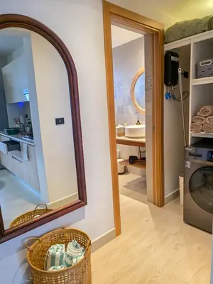 a bathroom with a mirror and a sink at Garden Breeze Penthouse & Pool View l Ghibli 401 in La Laguna