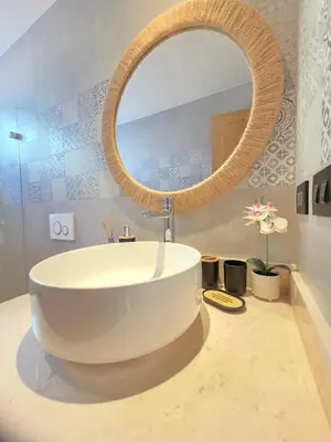 a bathroom with a large white tub and a mirror at Caribbean Comfort near the Sea l Cefiro 101 in La Laguna
