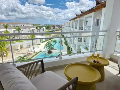 a balcony with a view of a pool at Garden Breeze Penthouse & Pool View l Mistral 401 in La Laguna
