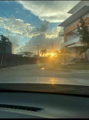a view of the sunset from a car window at Apartamento de recreación vista al mar in Boca Chica