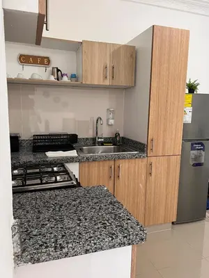a kitchen with a sink and a refrigerator at Luxury Royalty-1 in Santa Cruz de Barahona