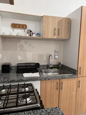 a kitchen with a sink and a stove top oven at Luxury Royalty-1 in Santa Cruz de Barahona
