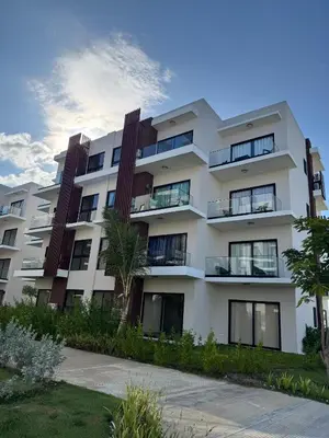 an apartment building with balconies on the side at Hermoso PUNTA CANA VISTA CANA in Colorado