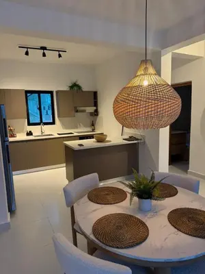 a kitchen and dining room with a table and chairs at Cocotal Beach Pool and Golf course Punta Cana RD in Colorado