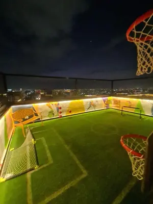 a soccer field at night with a net at Exclusivo Apartamento de un Dormitorio in Santo Domingo