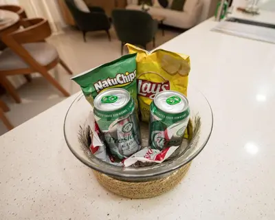 a basket of chips and snacks on a counter at Santiago s top Residence, Experience it & Believe it in Santiago de los Caballeros