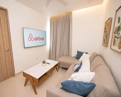 a living room with a couch and a coffee table at Santiago s top Residence, Experience it & Believe it in Santiago de los Caballeros