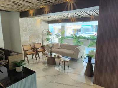 a living room with a couch and chairs and tables at RIKI R Boca del Mar III Apartment 406 in Boca Chica
