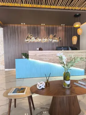 a lobby with a table and a sign that reads dream club at RIKI R Boca del Mar III Apartment 406 in Boca Chica
