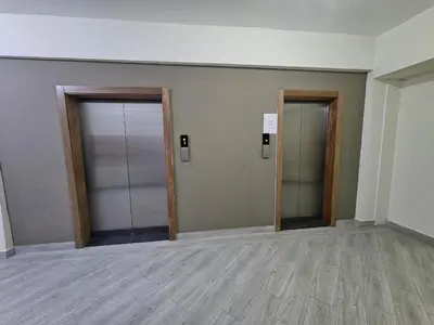 an empty room with two doors and a wooden floor at RIKI R Boca del Mar III Apartment 406 in Boca Chica