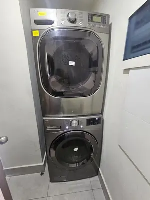 a washer and dryer in a corner of a room at RIKI R Boca del Mar III Apartment 406 in Boca Chica