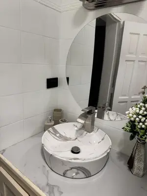 a white bathroom with a sink and a mirror at Costa Lunga-Tropicasa in Boca Chica