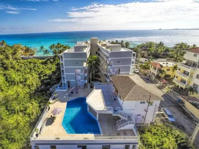 an aerial view of a building with the ocean in the background at Vista Marina Residence in Boca Chica