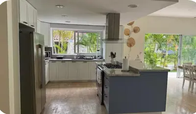 a kitchen with a stove and a counter top at Portillo Beach Family House in El Limón