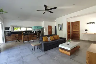 a living room with a couch and a table at Villas Riviera in Las Terrenas