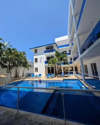 a large swimming pool in front of a building at El Legendario in Sosúa