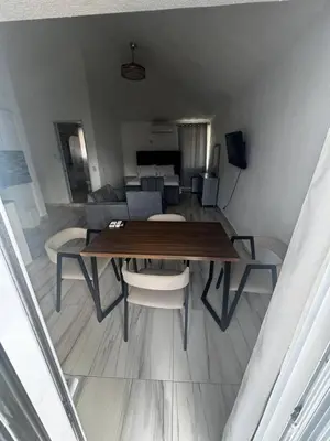 a dining room table and chairs in a room at El Legendario in Sosúa