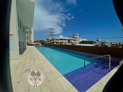 a swimming pool on the roof of a building at Boca del Mar III Apartment 724 in Boca Chica