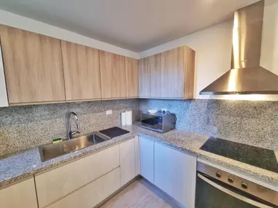 a kitchen with a sink and a microwave at Aqua Pearl ! Pool Access 2 BRM J 102 in Punta Cana