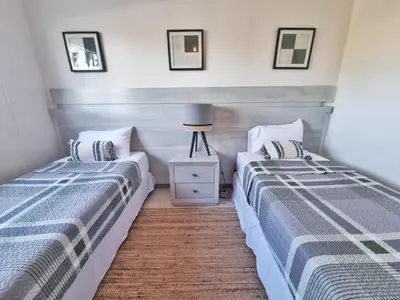 two beds sitting next to each other in a bedroom at Aqua Pearl ! Pool Access 2 BRM J 102 in Punta Cana
