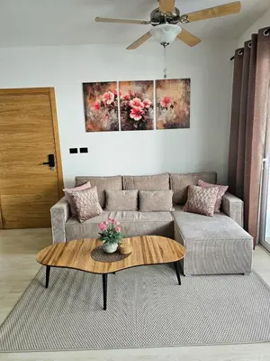 a living room with a couch and a table at Estrella Garden Condos Dominicus l Meridiana 204 in La Laguna
