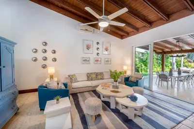 a living room with a couch and a table at Villa Polo Luxury Villa in Casa de Campo, La Romana in La Romana