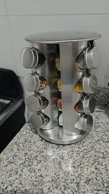 a bunch of cupcakes in a rack in a kitchen at Apartamento palmera del este 3 in La Javilla
