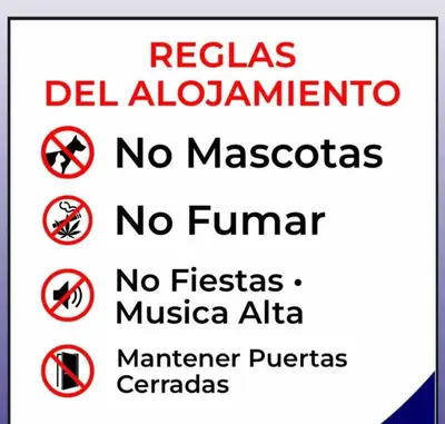 a sign that says no violators no violators no violators no cameras no at Apartamento palmera del este 3 in La Javilla